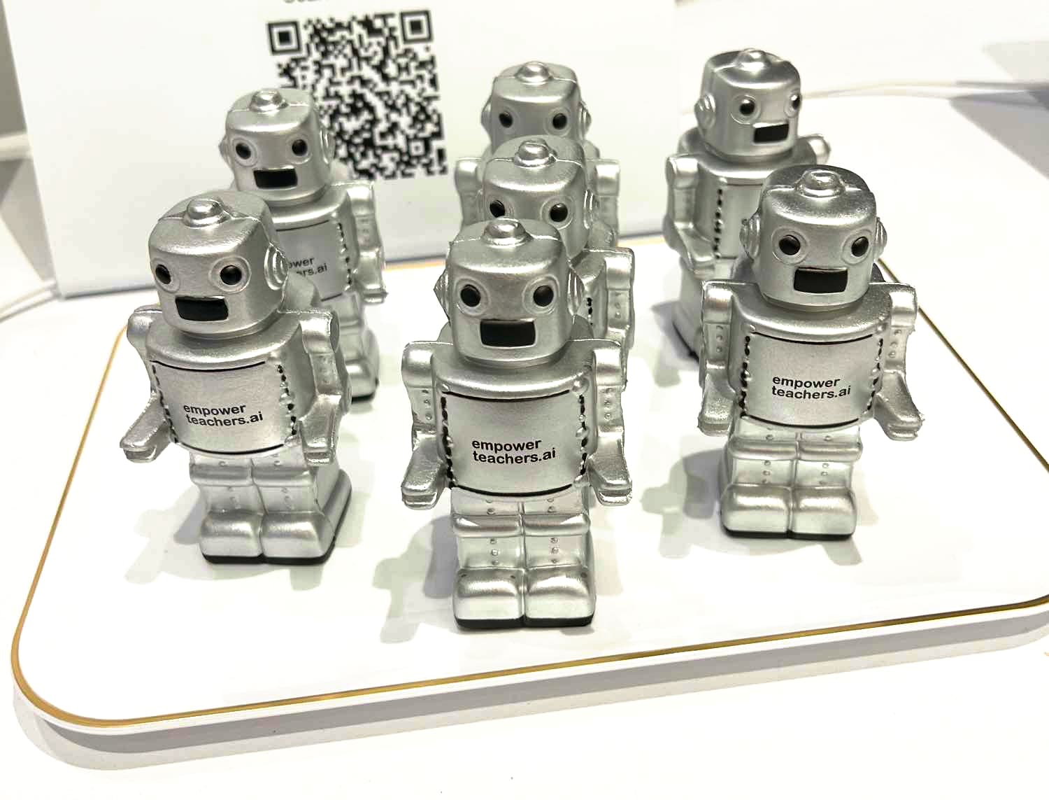Robot toys used as giveaways at the EmpowerTeachers.ai booth